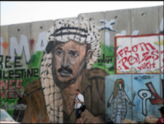 Mural of Yasser Arafat painted on Wall near Ramallah, Qalandia checkpoint Photo by Rhonda Spivak
