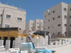 Palestinian labourers building new apartments in Beit-El.