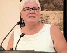 Former MLA Chris Melnick introducing the speakers