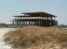 The frame of the unfinished Palace begun by King Hussein on the Hill of Beans (Tel-El-Ful)