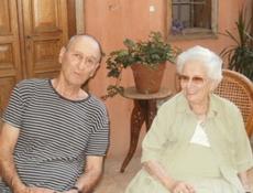 Ruth Dayan with her  son Udi Dayan in the courtyard of a a stately Arabesque home in Jaffa