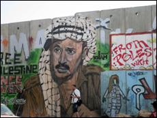 Mural of Yasser Arafat painted on Wall near Ramallah, Qalandia checkpoint photo by Rhonda Spivak