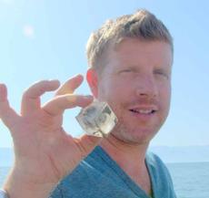 Noam Bedein with a Square Salt Diamond taken from a Sinkhole at the Dead Sea
