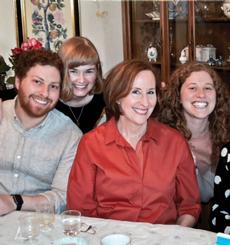 Faith Kaplan in red surrounded by her fans