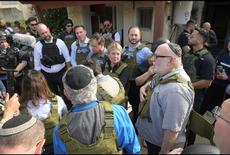 MP Morantz is with the Canaidan delegation at Kibbutz Kfar Aza, where they went with the speaker of the Knesset. The  group was given flack jackets and helmets