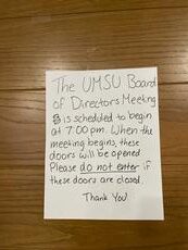 The door with a sign about the meeting of UMSU Board on April 11,2024