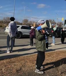 Palestinian protesters outside Superstore