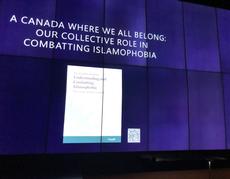 An illuminated wall banner for the "Combatting Islamophobia" event at the CMHR blocks out the usual scrolling donor wall, displaying the names of over 8,500 donors, many of whom are Jews